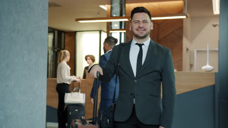 businessman checking into hotel
