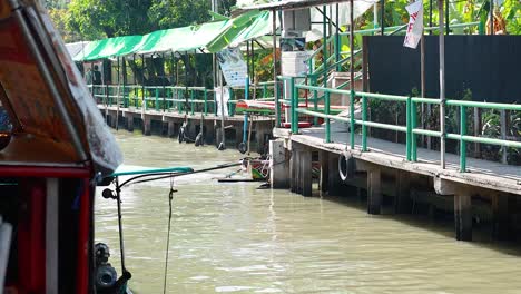 a boat travels along a bustling canal