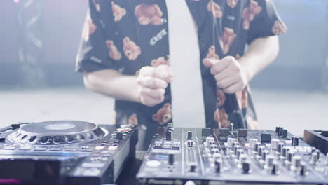 a dj mixing music at a nightclub