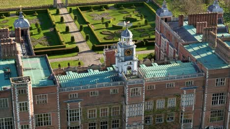 aerial view overlooking hatfield country house bell tower rooftops and landscaped estate gardens