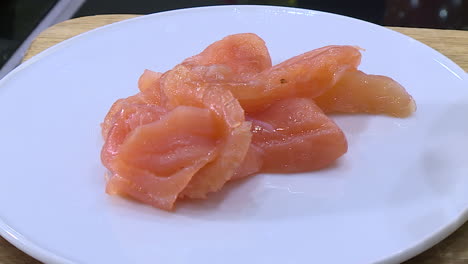 smoked salmon slices on a plate