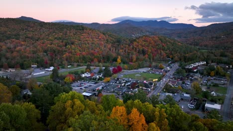 aerial-push-in-to-banner-elk-nc,-north-carolina-over-fall-leaves