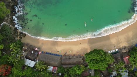 Surf's-up,-capturing-Carrizalillo-beach-perfect-waves-from-above-at-Puerto-Escondido,-Oaxaca,-Mexico