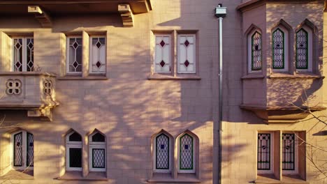 Dolly-in-the-architecture-of-the-Sermini-Castle-of-Tudor-design-with-spire-shaped-windows,-heritage-in-perfect-condition,-Santiago,-Chile