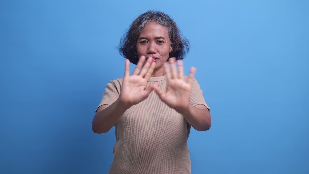 Frustrated annoyed irritated middle age woman covering ears gesturing no, avoiding advice ignoring unpleasant noise loud voices