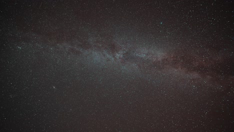 milky way in the glimmering night sky in a timelapse video