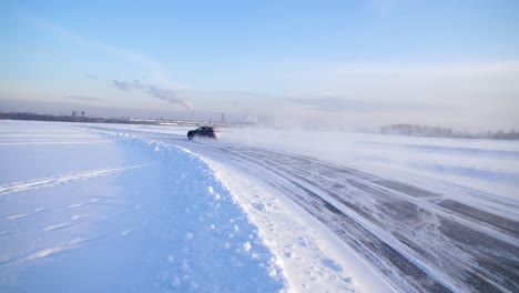 car drifting on a snowy ice road