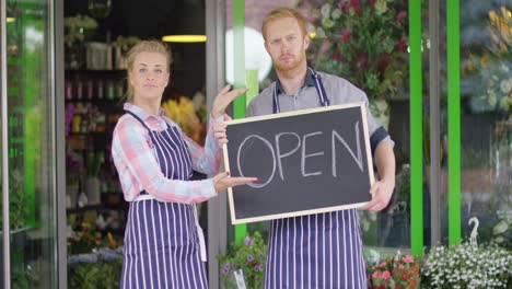 smiling workers of floral shop