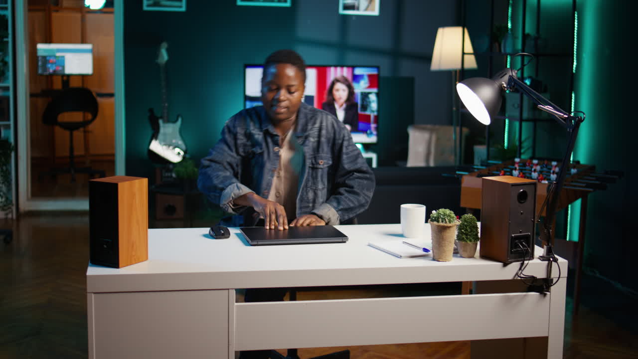 Woman working from home office at night