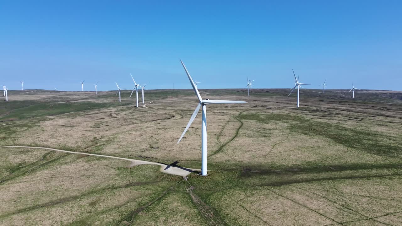 Aerial view of wind turbines farm to produce clean renewable sustainable energy target netzero