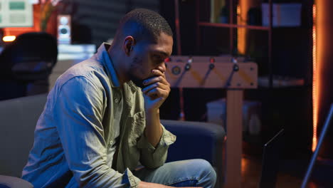 vertical video african american guy being overworked with headache at modern loft