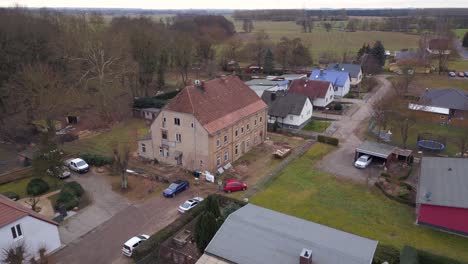 Magic-aerial-view-flight-dilapidated-Manor-house-Lüssow-Mecklenburg-Western-Pomerania-germany-winter-2023