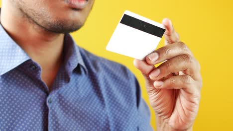 Close-up-of-person-hand-holding-credit-card
