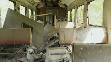 the inside of a ruined train car in the chernobyl exclusion zone - wide rolling