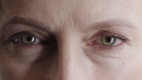 close-up-mature-woman-green-eyes-looking-at-camera-blinking-pensive-staring-human-beauty