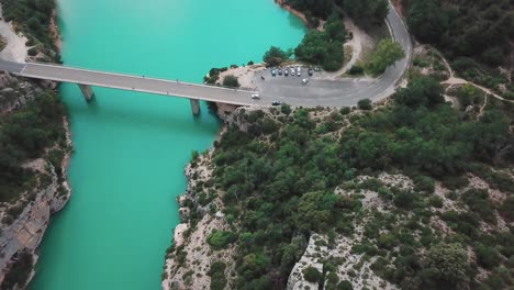 Forward-high-angle-aerial-shot-of-a-bridge-connecting-the-end-of-a-gorge-in-France