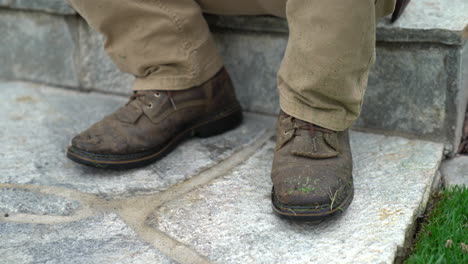 Man-resting-with-dirty-boots