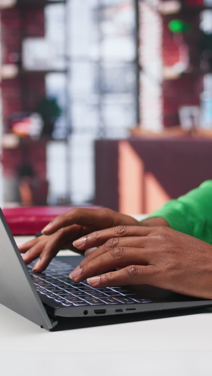 Vertical Video Freelancer creating articles content for his online blog at home desk