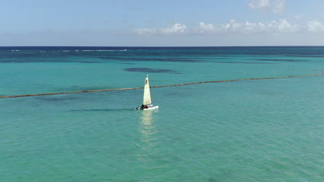 catamaran sailing in turquoise waters off caribbean beach in dominican republic, fun lifestyle and recreation in tropical paradise