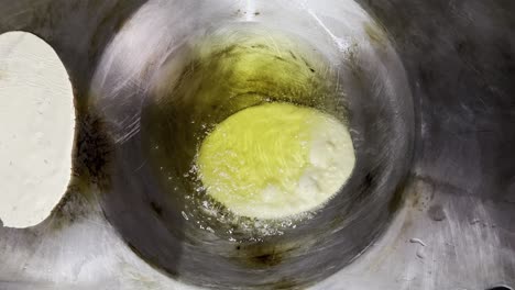 frying flatbread in a hot pan
