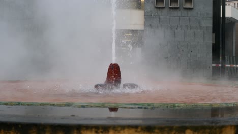 geysey fountain with hot mineral water in downtown karlovy vary, czech republic