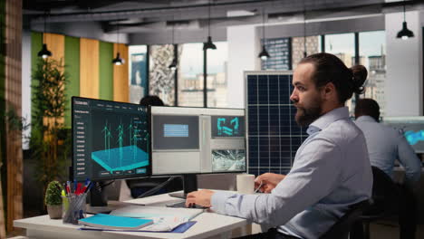 specialist develops clean energy solutions, drinks coffee, talks with coworker