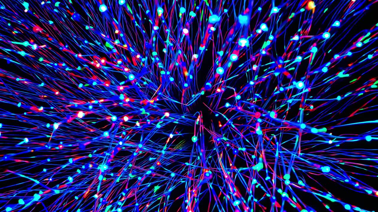 Dynamic visual sequence of colorful light strands expanding outward, creating a mesmerizing flow of vibrant energy and motion in a dark background
