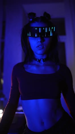 woman in led glasses in a night setting