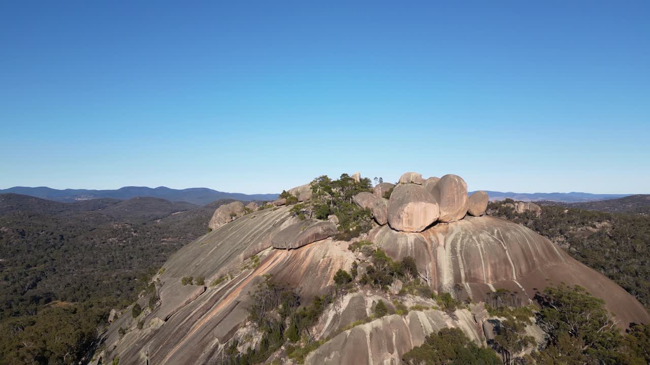 Left to right aerial footage over the Pyramid, Girraween National Park, Southern Queensland Australia. Girraween National Park is located near Stanthorpe and the Queensland and New South Wales border.