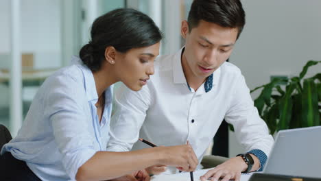 beautiful business woman team leader training asian intern using laptop computer sharing ideas colleagues working together in office