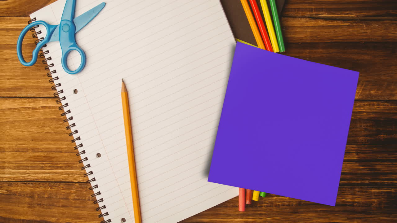 Animation of memo note with copy space over notebook and pencils on desk