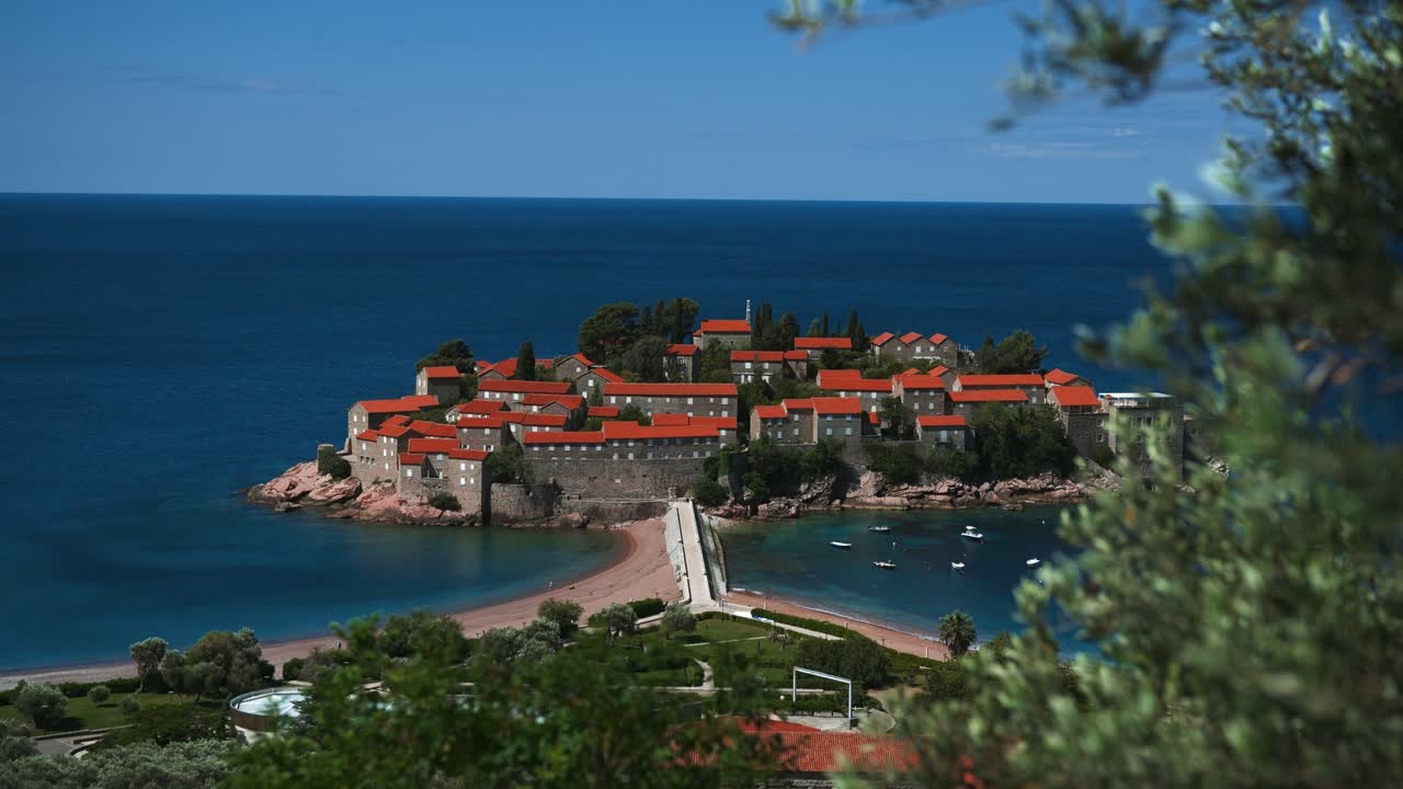 Scenic Sveti Stefan island in Montenegro with ancient monastery. Blue Adriatic Sea, seen from above