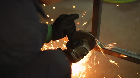 Angle-Grinder-Cutting-Metal-At-Workshop-7