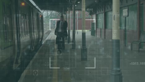 animation of financial data processing over caucasian man by train in train platform