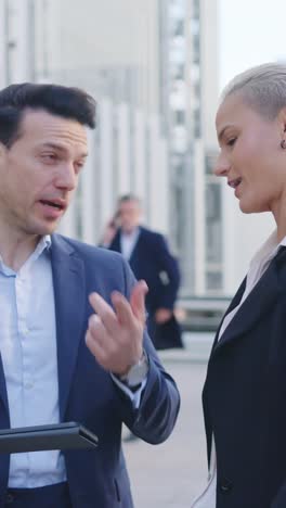 business professionals having a discussion outdoors