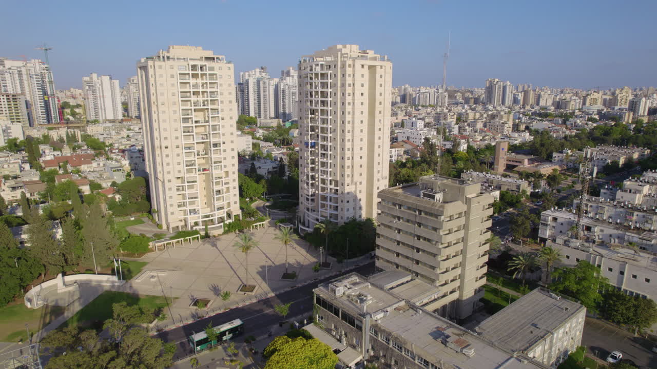 Holon's old city hall next to modern residential towers - parallax shot