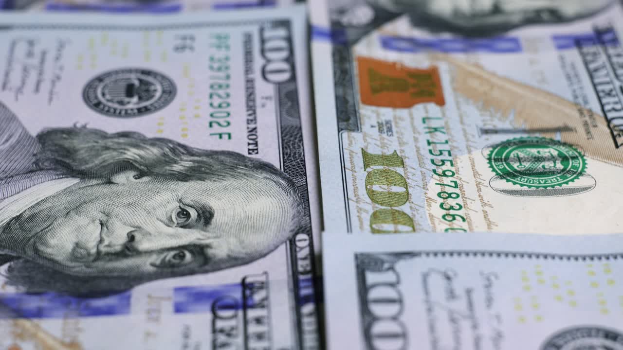 billetes de dólar estadounidense, dinero de papel, moneda de tasa de cambio. billetes de efectivo. el concepto de finanzas e inversión. cien dólares estadounidenses. economía empresarial