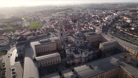 Christian-catholic-church,-cathedral-in-Mafra,-Portugal,-aerial-orbit-establish