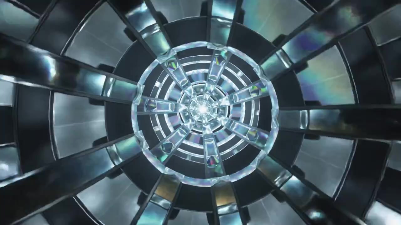 Moving camera approaching concentric metal rings and shiny panels in studio, showing central light