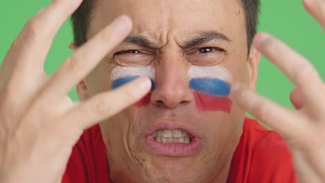 man with russian national flag upset with a referee