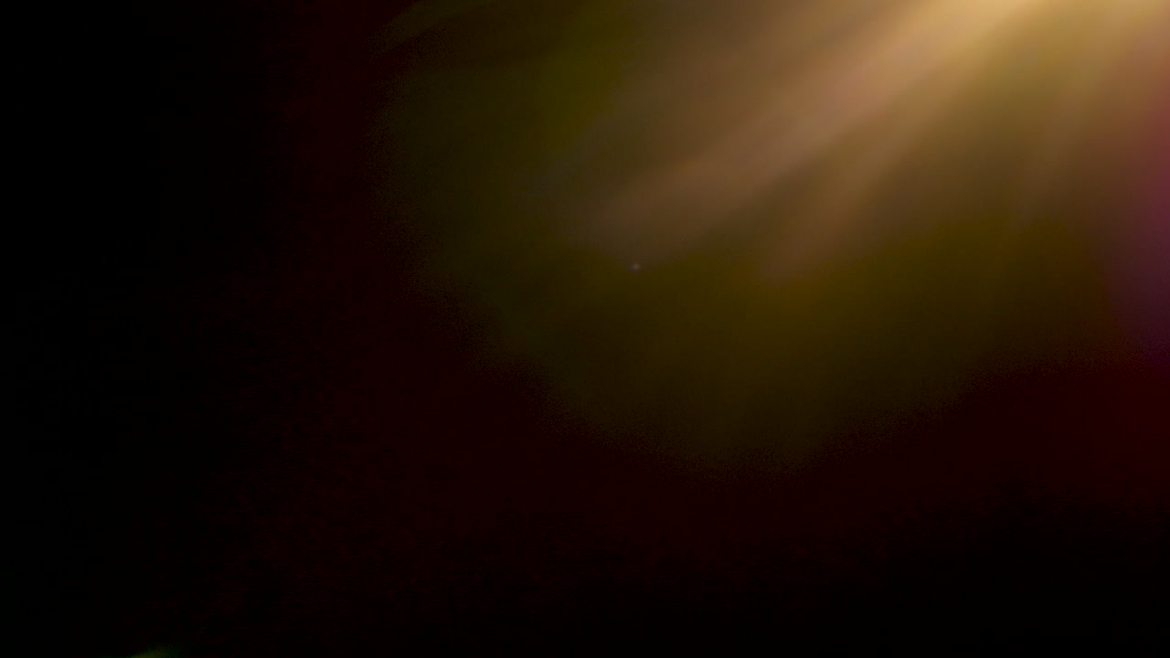 Beautiful abstract warm lens flares on black background