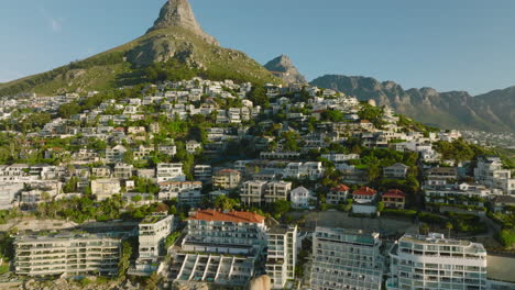 Luxury-residences-and-hotels-along-sea-coast.-Backwards-revealing-urban-borough-in-tourist-destination.-Cape-Town,-South-Africa