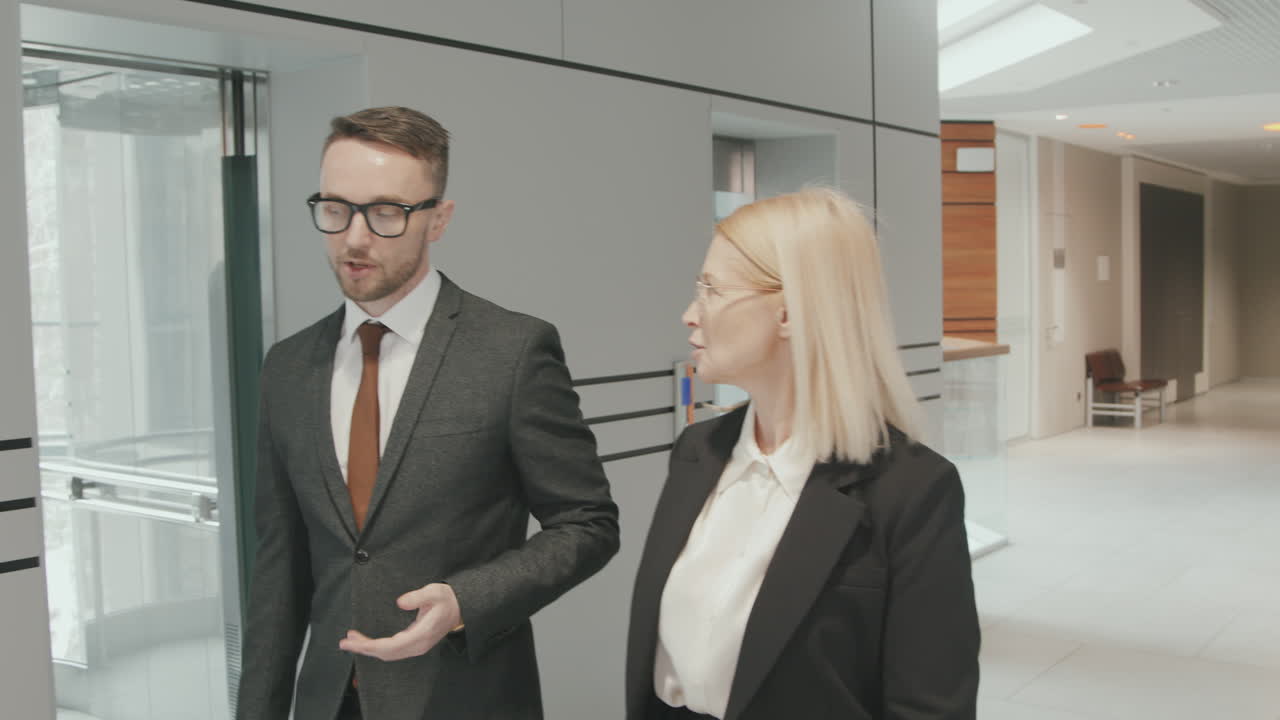 Business Partners Walking through Office