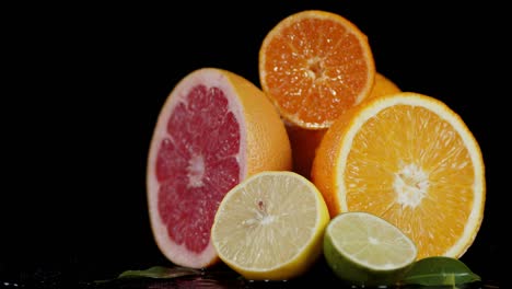 the pieces of different citrus slowly rotate.