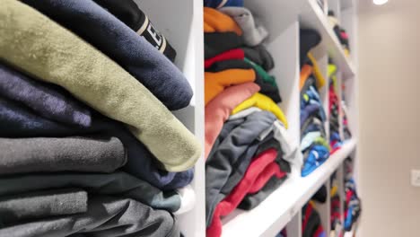 organized clothes on shelves