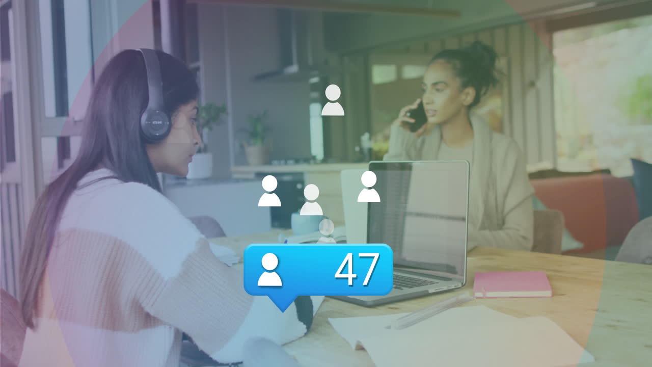 Two women working from home with social media notification animation over scene