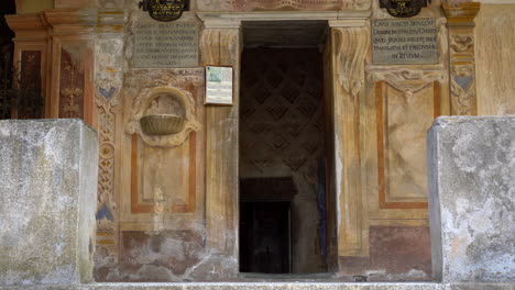 Entrance-of-Holy-Sepulchre-at-Mountain-of-Varallo,-a-christian-devotional-complex,-a-unesco-world-heritage-site-close-to-river-Sesia-near-the-town-of-Varallo-Sesia-in-Italy