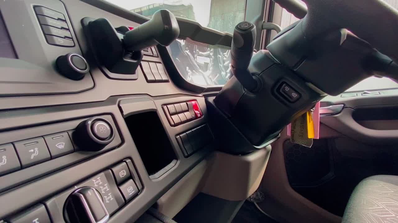 Driver's cabin of modern truck with lots of automatic buttons