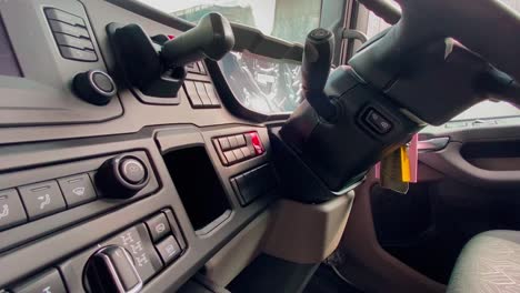 driver's cabin of modern truck with lots of automatic buttons