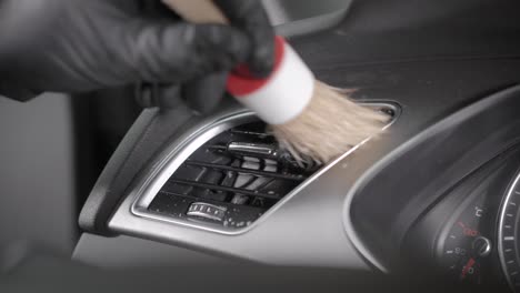 unrecognizable person wiping air duct